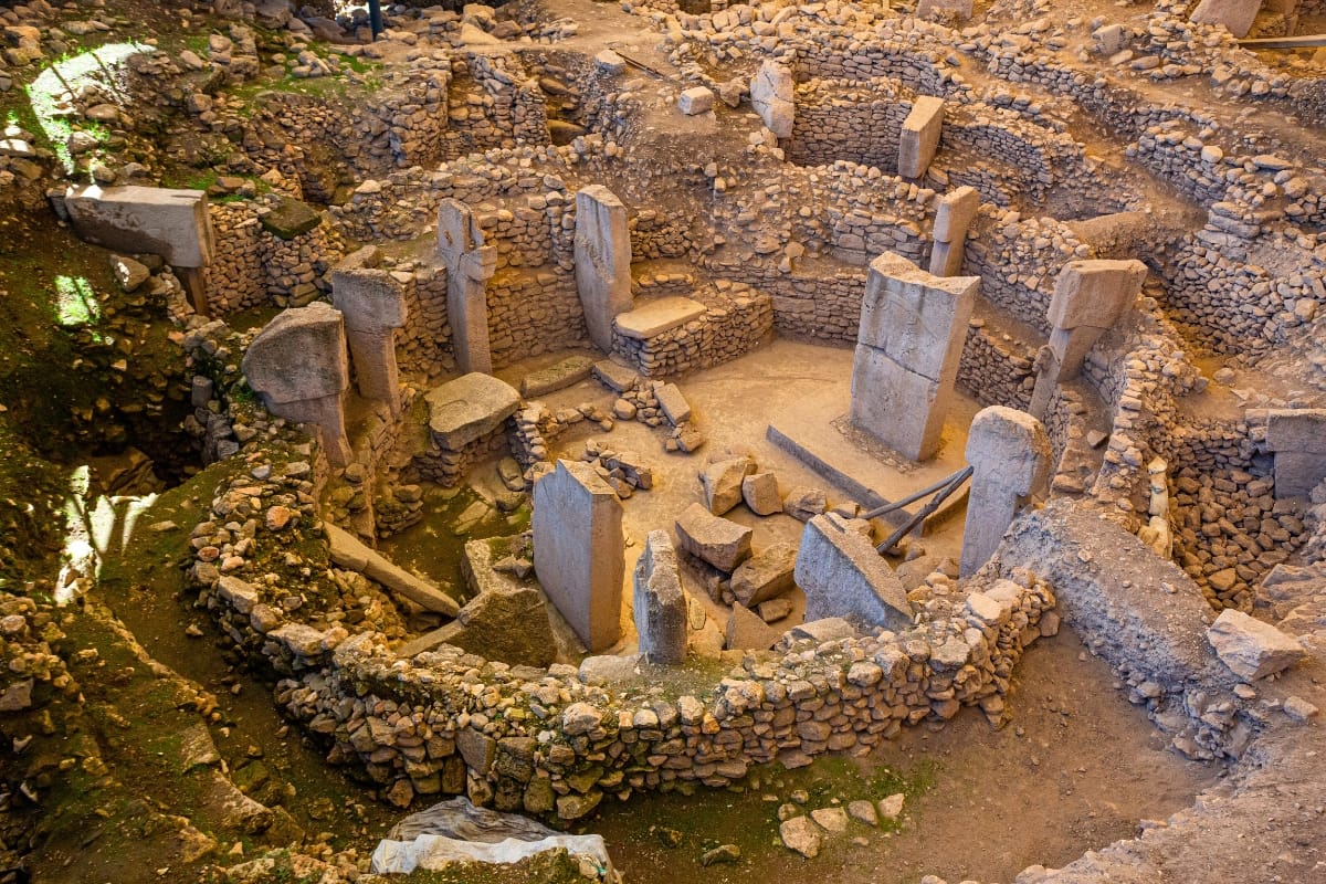 Ancient stone pillars of Göbekli Tepe under a wide Turkish sky, the world’s oldest known temple and a portal to humanity’s spiritual awakening.