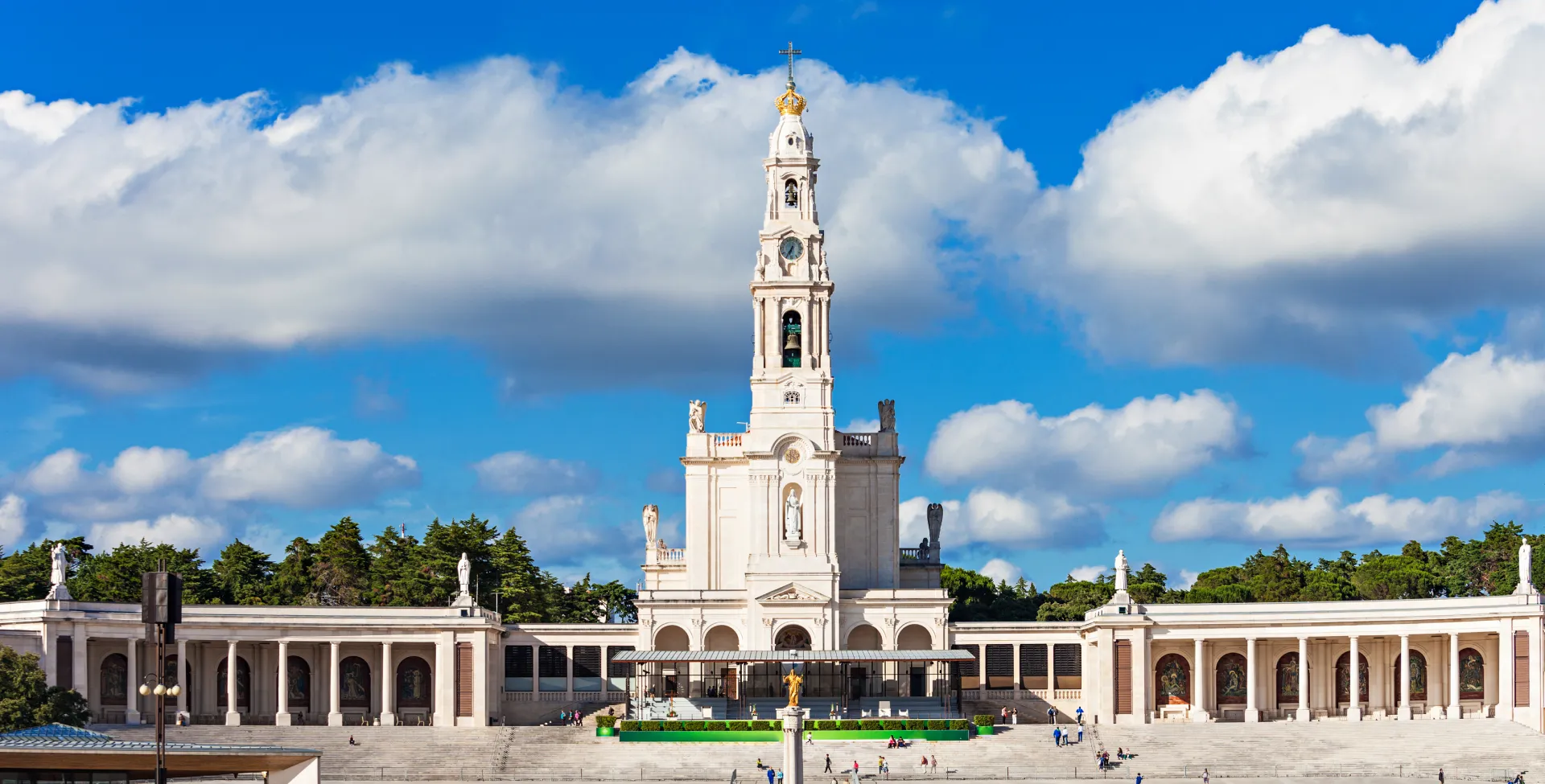 he Sanctuary of Fátima under a radiant sky, a sacred symbol of divine alignment and the magnetic power of unwavering faith.