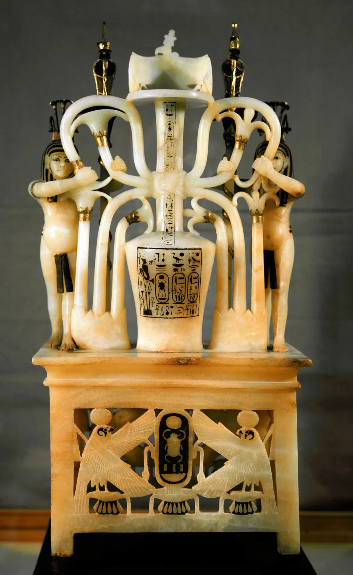 Alabaster perfume vase of King Tutankhamun with lotus motifs and ritual anointing symbolism