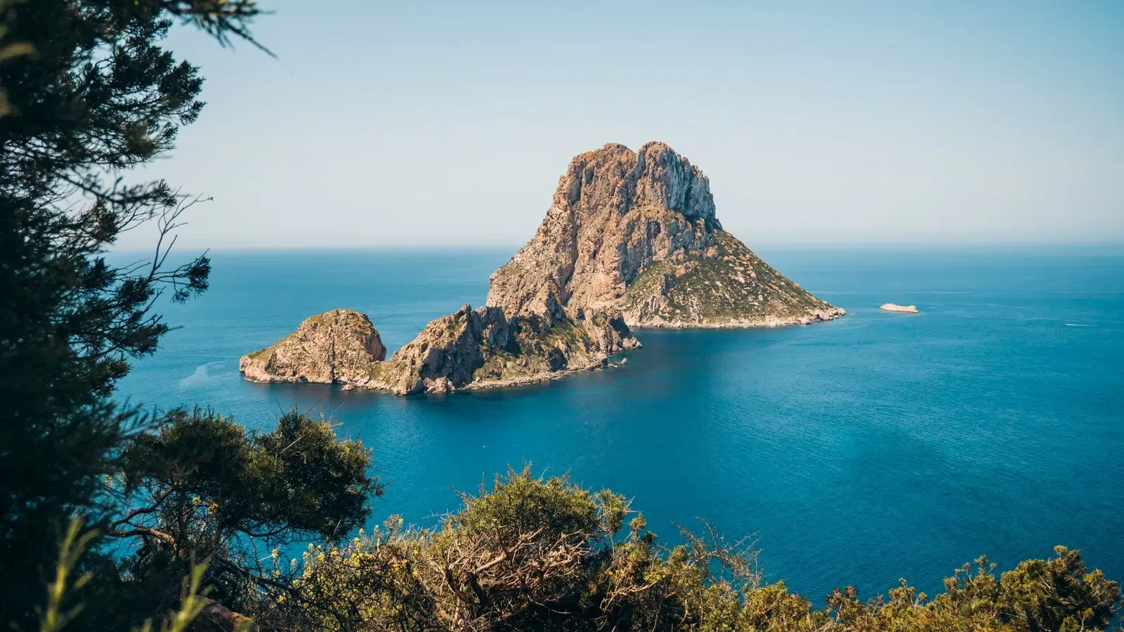 Es Vedrà island off the coast of Ibiza, rising from the sea in quiet stillness