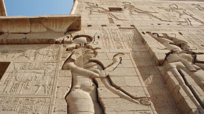Stone relief of the goddess Isis and Horus at the Temple of Philae, Egypt