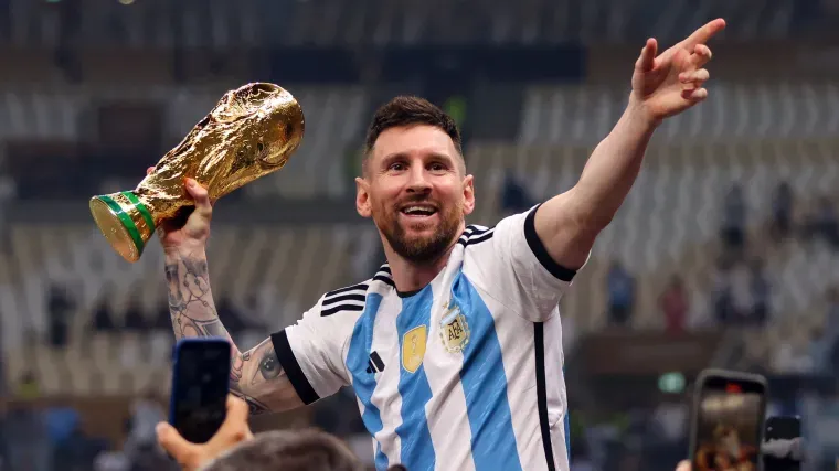 Lionel Messi lifting the FIFA World Cup with Argentina, celebrating the fulfillment of a lifelong destiny.
