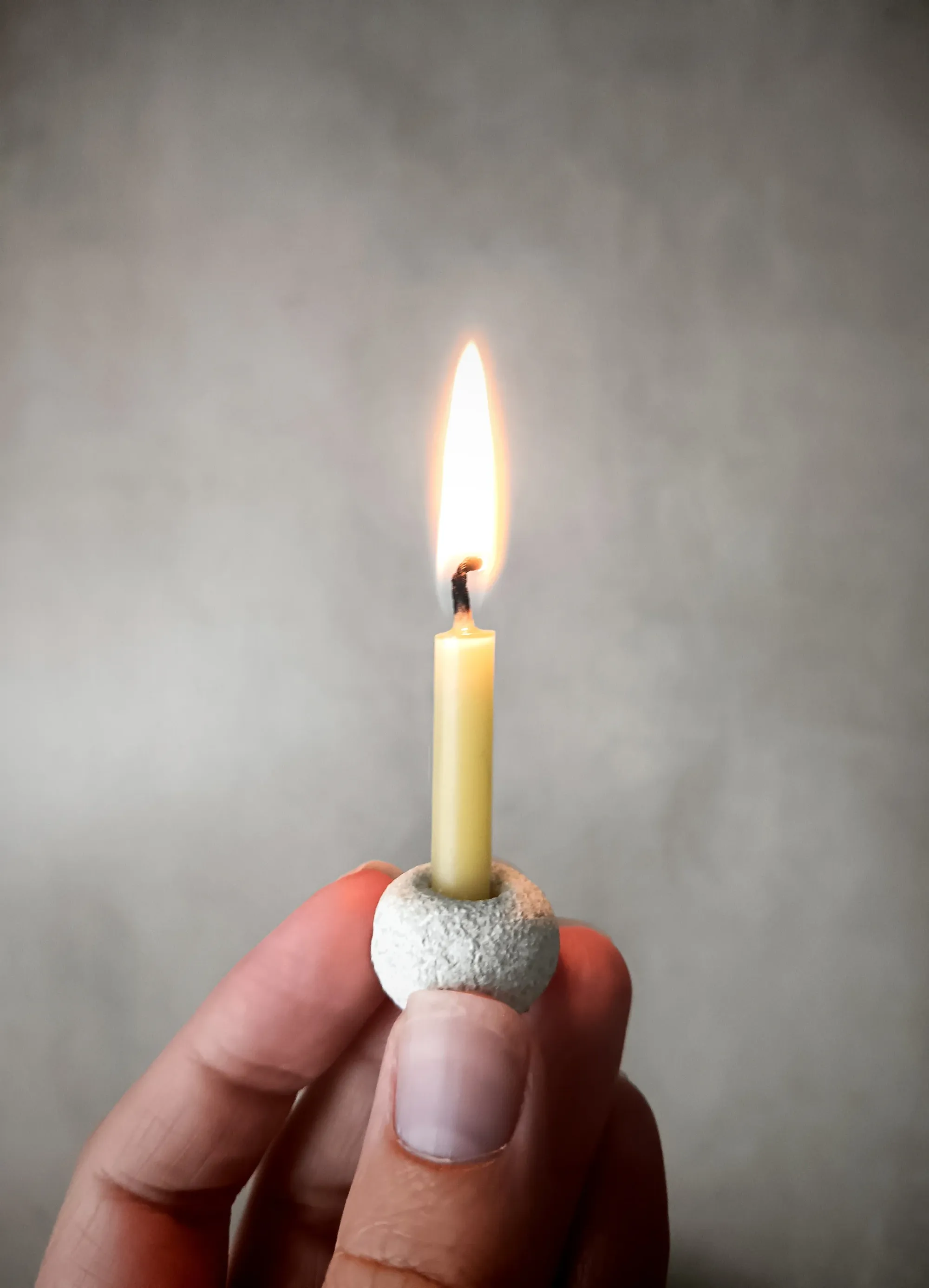 Quiet meditation space with candle symbolizing focused inner practice.