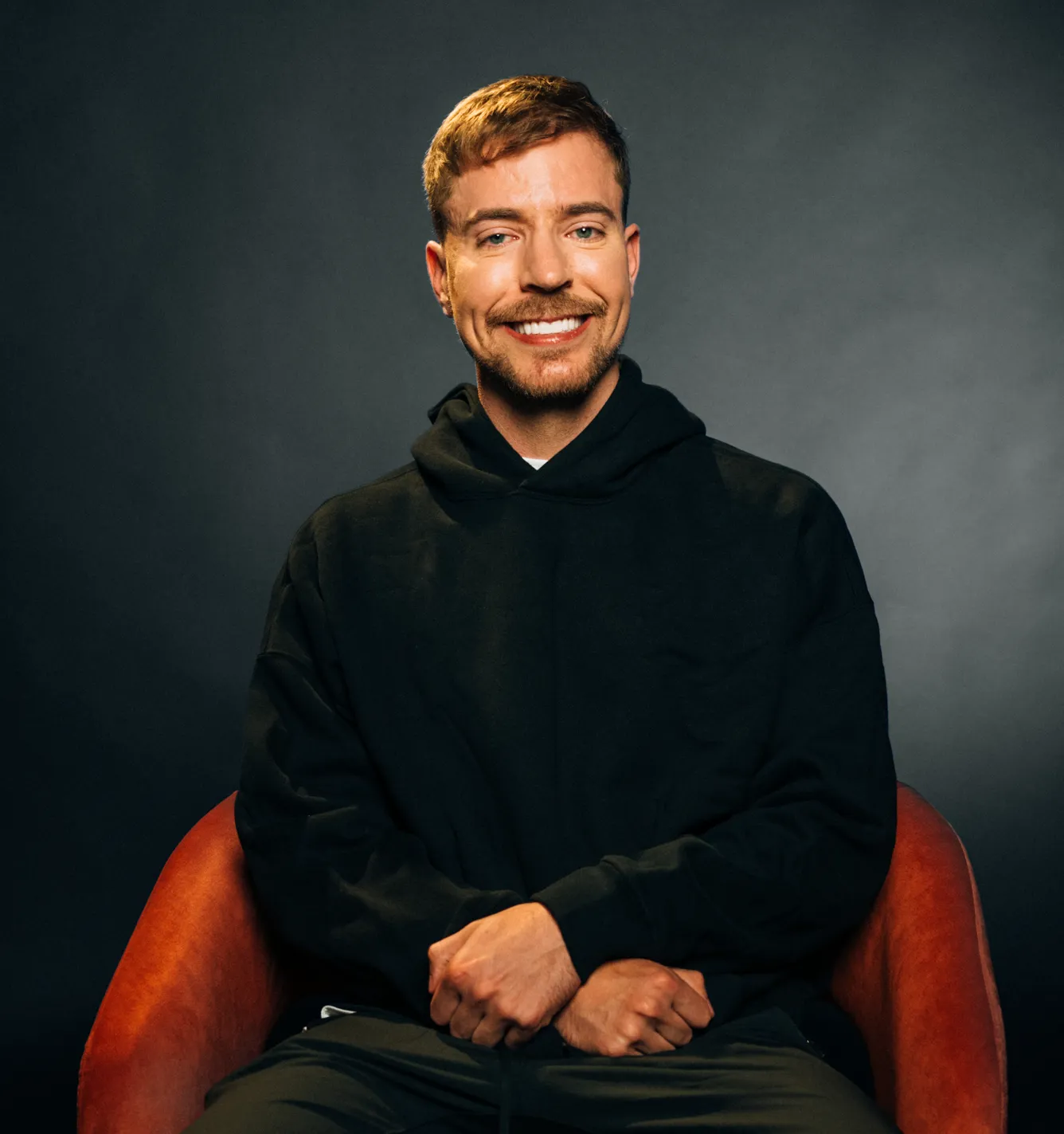 Editorial portrait of MrBeast (Jimmy Donaldson), highlighting focus, confidence, and the mindset behind his creative success