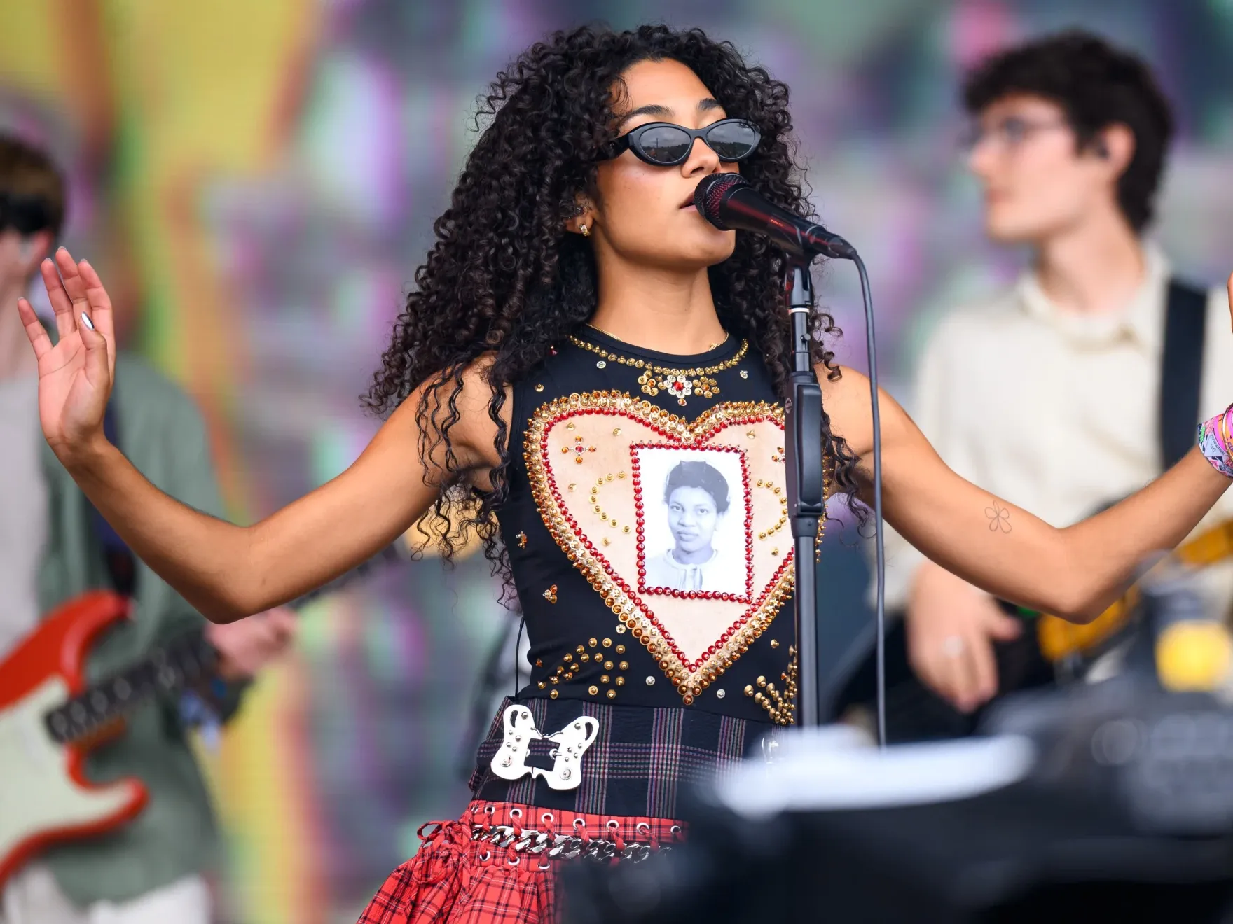 Olivia Dean performing live, expressing belief alignment, emotional authenticity, and manifestation through divine timing