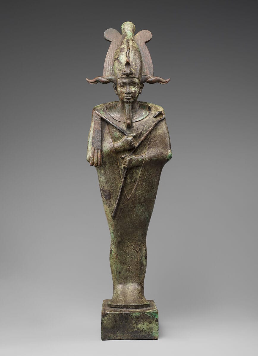 Ancient bronze statuette of Osiris, Egyptian god of kingship, order, and resurrection, symbolizing the Divine Masculine.