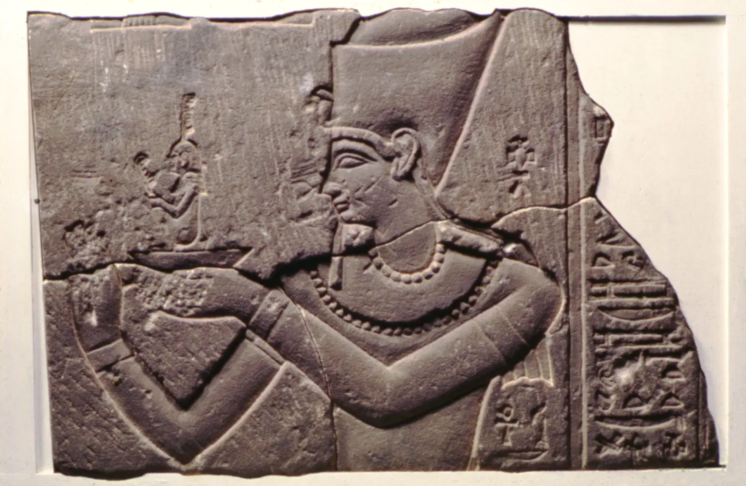 Relief showing a pharaoh offering the goddess Ma’at, symbolizing the maintenance of cosmic balance and order in ancient Egypt