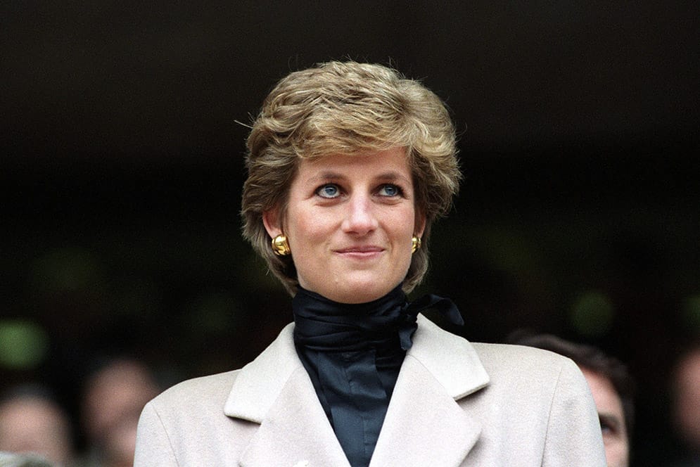 Princess Diana in a candid public moment, embodying emotional intelligence, compassion, and soft power manifestation