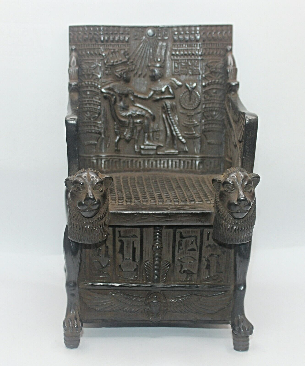 Ptolemaic ceremonial throne with lion armrests and solar symbolism, ancient Egypt.