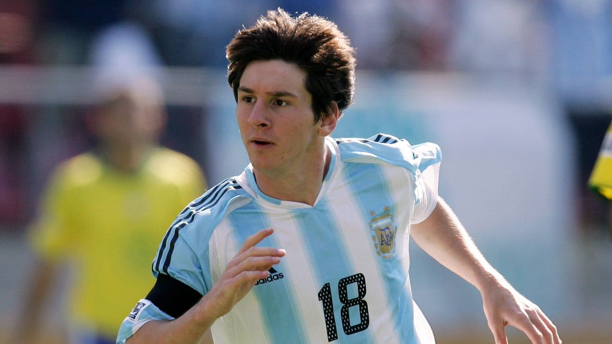Young Lionel Messi playing for Argentina during his teenage years, already embodying focus, belief, and emerging identity.