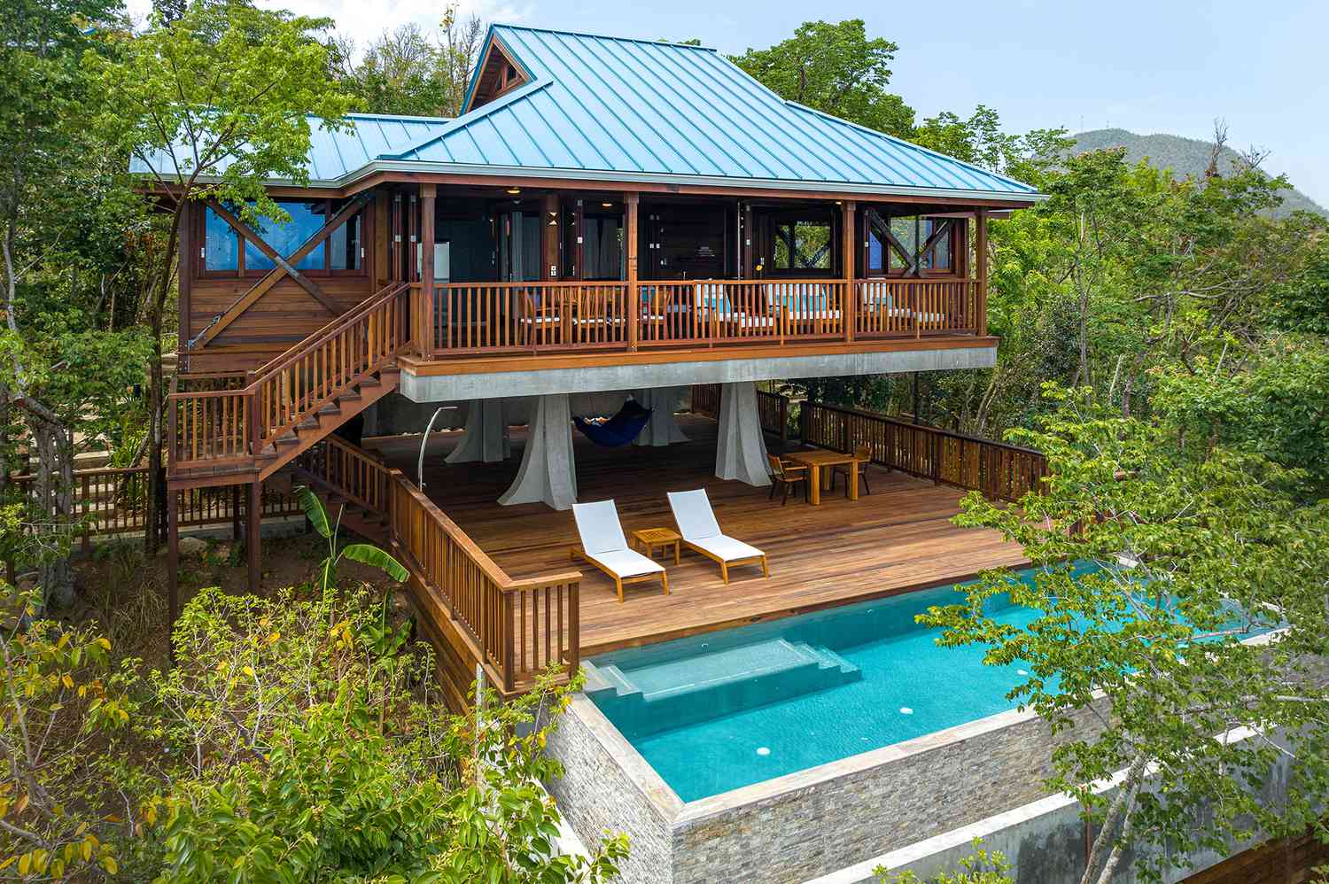 Secret Bay Dominica luxury villa overlooking the Caribbean Sea with private pool and rainforest surroundings