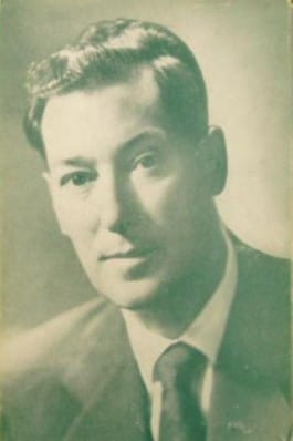 Retrato joven de Neville Goddard, maestro espiritual conocido por enseñar la Ley de la Asunción y el poder de la imaginación para manifestar la realidad
