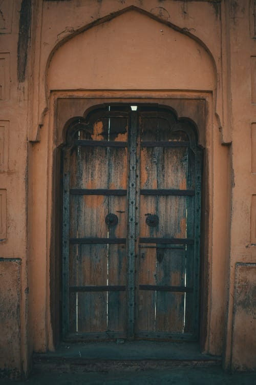 Traditional Islamic arch door shut symbolizing Abdullah shutting the door on Neville Goddard