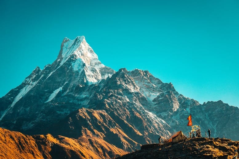 Golden sunrise over Himalayan peaks symbolizing Steve Jobs spiritual awakening and visionary insight on manifestation.