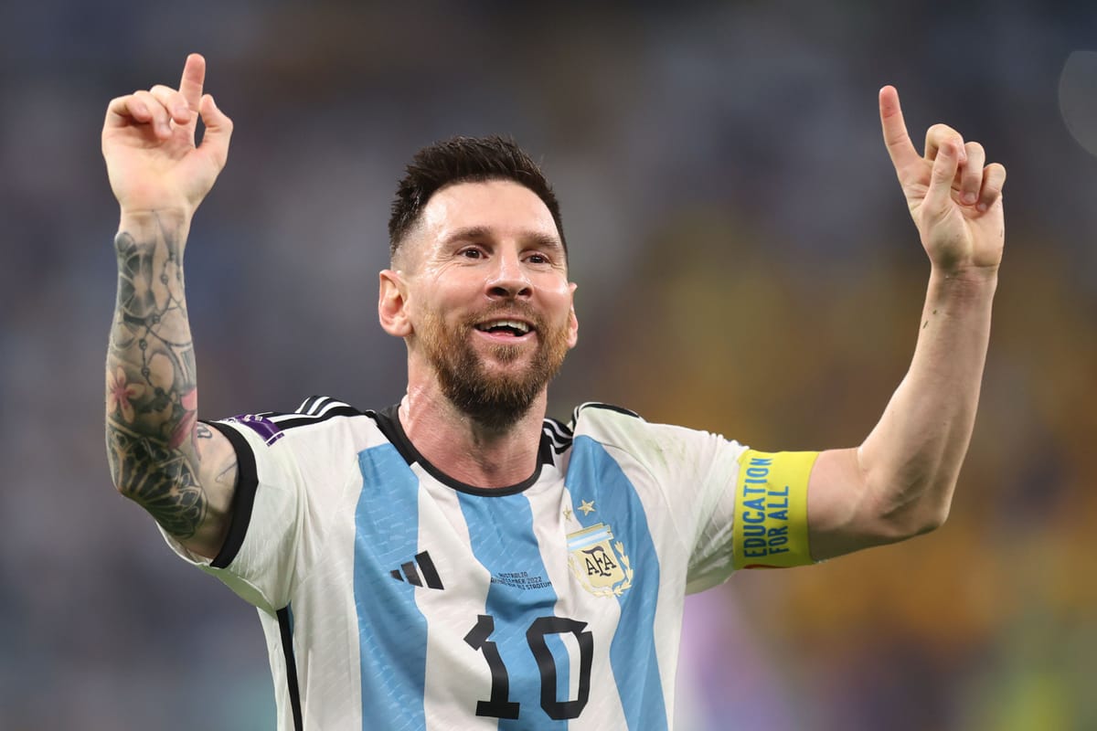Lionel Messi celebrating Argentina’s World Cup victory, arms raised in gratitude and belief.