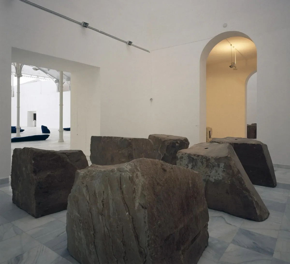 Installation view of Anish Kapoor’s Void Field (1989), stone blocks in a museum gallery.