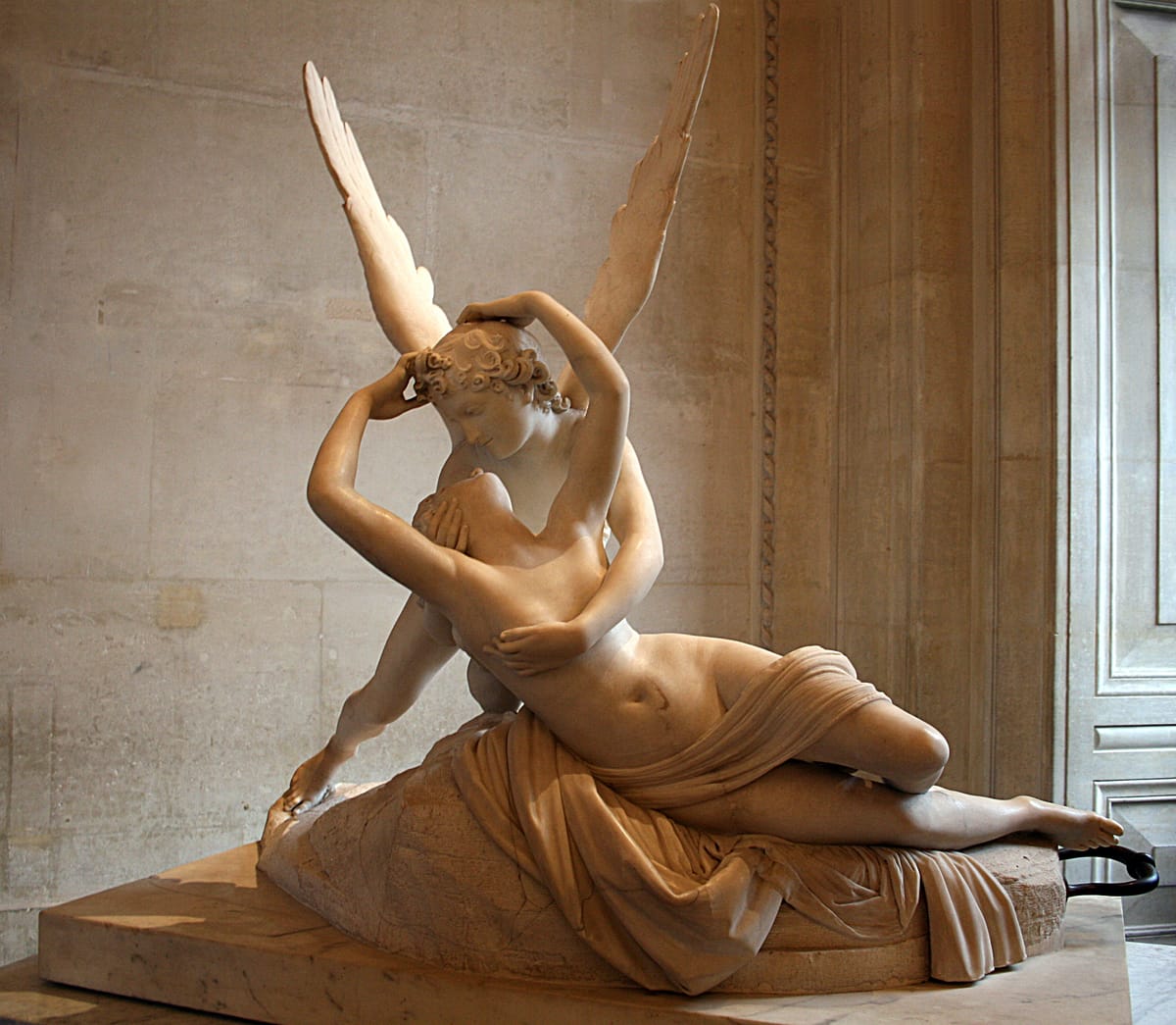 Antonio Canova’s L’Amour et Psyché à demi couchée sculpture depicting Psyche awakening in the arms of Cupid, symbolizing subconscious identity activation and emotional memory encoding.