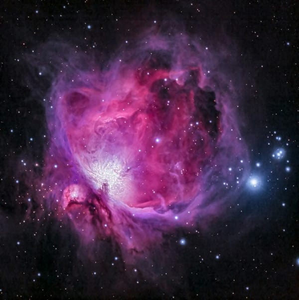 Pink cosmic nebula swirling with stardust—mystical backdrop for Kabbalah and manifestation