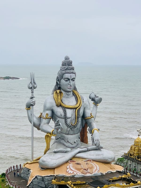 A colossal statue of Lord Shiva in Murudeshwar, India, gazing out over the ocean — a majestic symbol of Divine Masculine power and presence. 