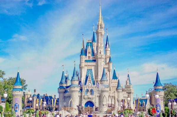 Cinderella Castle glowing at dusk—symbol of imagination becoming reality in Walt Disney’s Law of Attraction journey